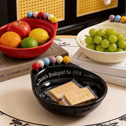 Leken fot-formet snacksbolle med integrerte gafler til frukt